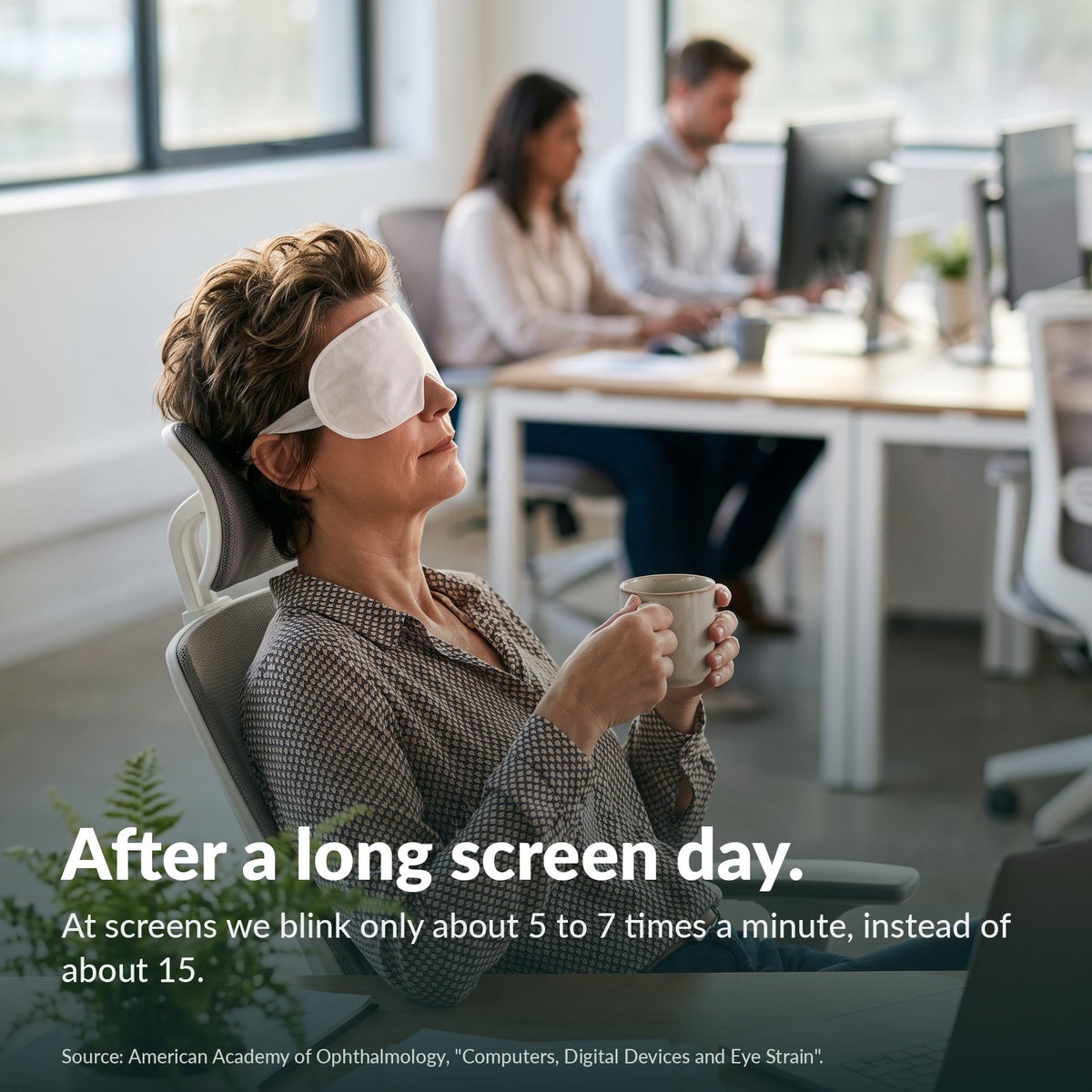 After a long screen day: woman with a warm eye mask at the office (model)
